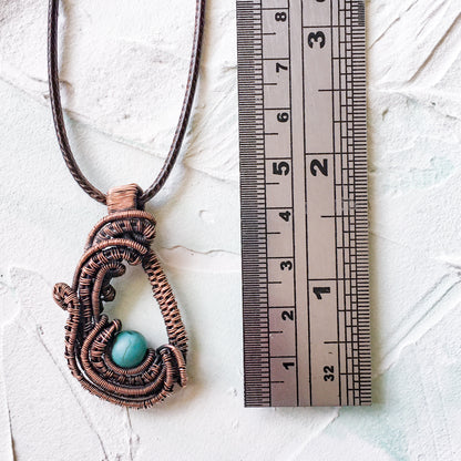Copper Wire Woven Pendant Hand Made with a howlite turquoise bead