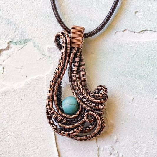 Copper Wire Woven Pendant Hand Made with a turquoise bead
