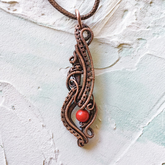 Elegant Copper Wire Woven Pendant with Red Mashan Jade Bead