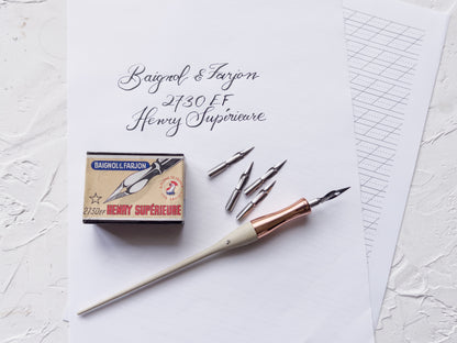 Fountain pen with ink cartridges and box on a textured white surface