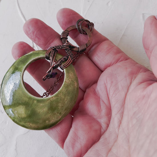 Green and copper ceramic pendand with amethyst bead