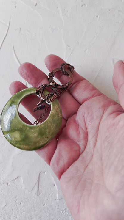 Green and copper ceramic pendand with amethyst bead